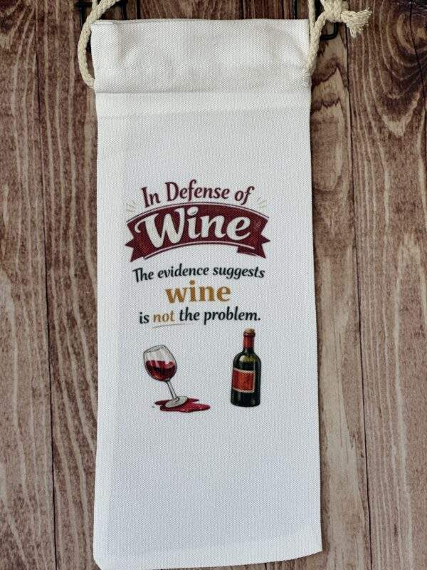 A white wine bag with a wine bottle and glass. Text reads, 'In Defense of Wine, the evidence suggests wine is not the problem.'