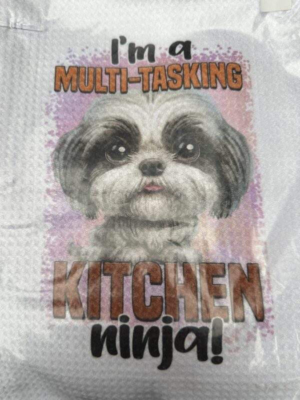Small cute dog face on white dishtowel. Text reads 'I'm a multi-tasking kitchen ninja!'