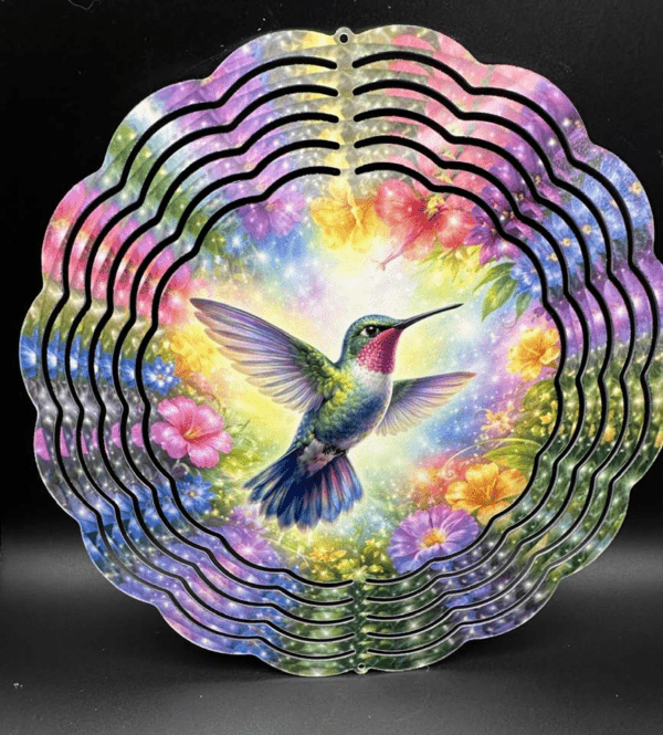 A windspinner of a hummingbird surrounded by a brilliant rainbow of flowers.